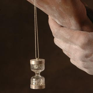 Clock pendant in hand by Dana Bloom